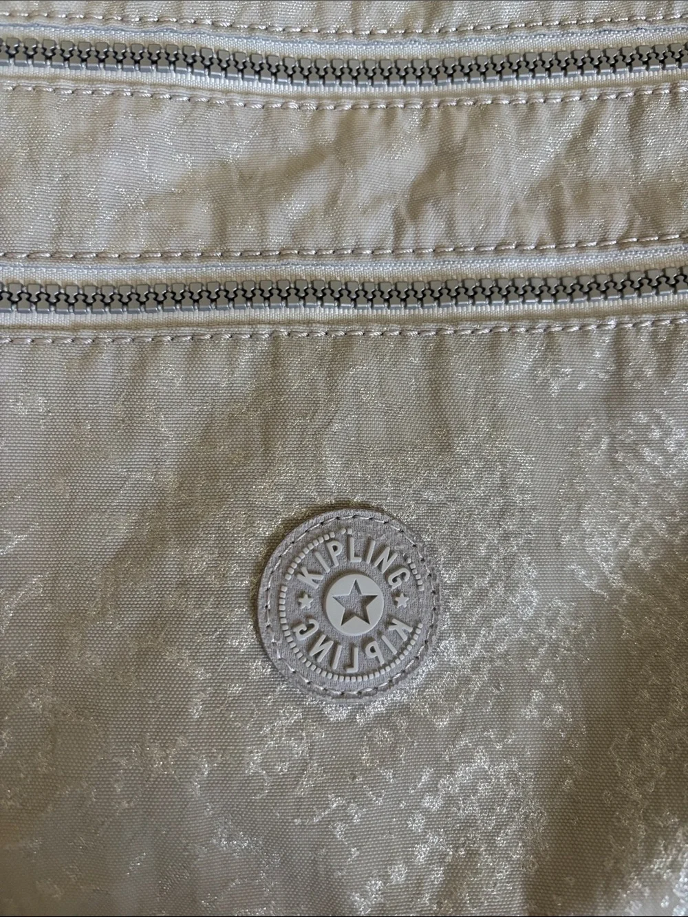 Kipling Light Gray Crossbody Bag with Multiple Zips